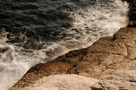 the rocky beach breaks the huge wavesの写真素材