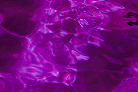 purple abstract background of wavy water surface (lilac)の写真素材