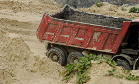 huge truck on a coal mine open pitの写真素材