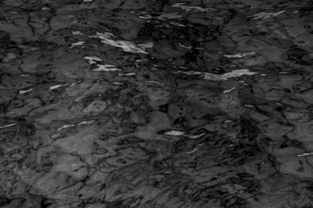 grey abstract background of wavy water surfaceの写真素材