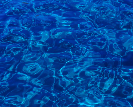 blue abstract background of wavy water surfaceの写真素材