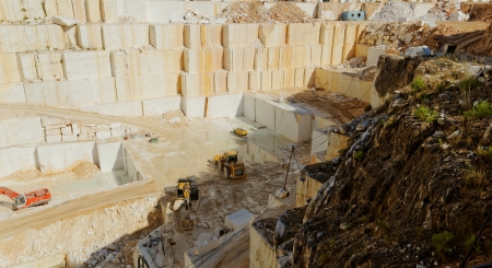 Detail of huge Thassos white marble quarry (mine) with grabber