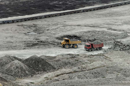 huge truck on a coal mine open pitの写真素材