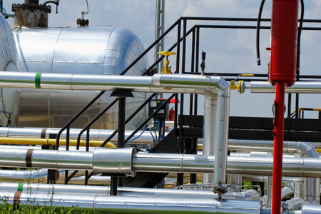 industrial pipes at an oil wellの写真素材