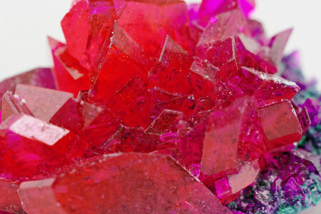 close up of crystals in ruby color on white background (red crystal)の写真素材