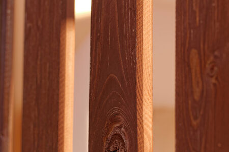 planks fence dyeing with brown paint and brushの写真素材