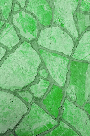 Background of a large stone wall texture (green)の写真素材