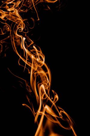 yellow smoke in black backgroundの写真素材