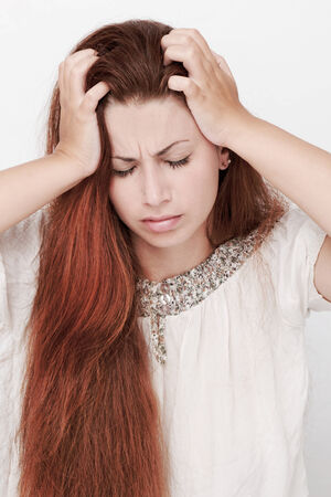 Beautiful young woman with long hair posingの写真素材