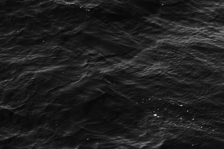 grey abstract background of wavy water surfaceの写真素材