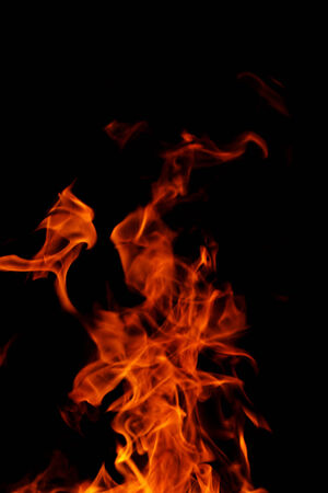 red flames of fire as red black backgorundの写真素材