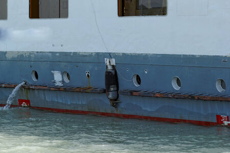 Photo of an old and rusty ship's sideの写真素材