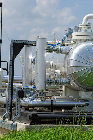 industrial pipes at an oil wellの写真素材