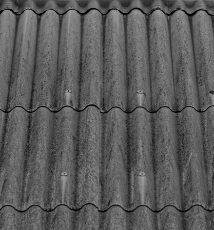 monochrome texture of gray corrugated slate roofの写真素材