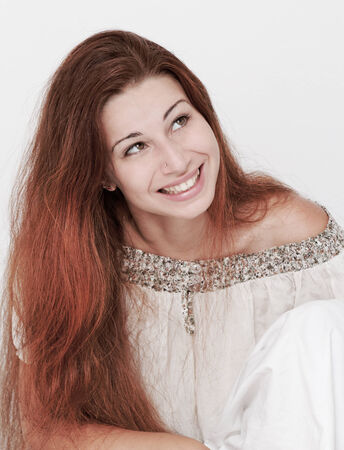 Beautiful young woman with long hair posingの写真素材