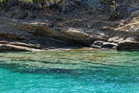 rocky beach with turquoise sea in greece thassos islandの写真素材