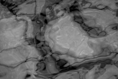 grey abstract background of wavy water surfaceの写真素材
