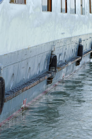 Photo of an old and rusty ship's sideの写真素材