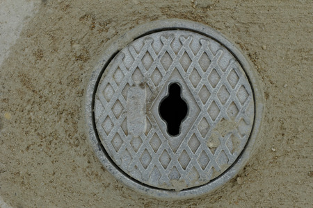 Close up photo of a gray outdoor faucet coverの写真素材