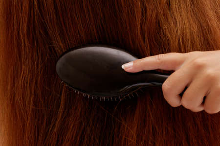 Beautiful young woman with long hair posingの写真素材