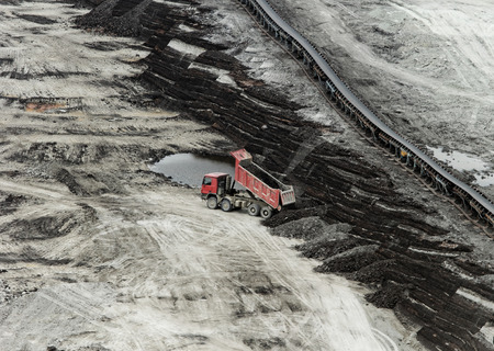 huge truck on a coal mine open pitの写真素材