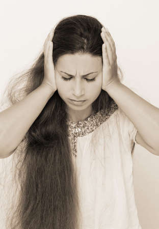 Beautiful young woman with long hair posingの写真素材