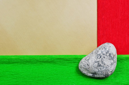 Decorative page with red and green stripe and stone in the cornerの写真素材