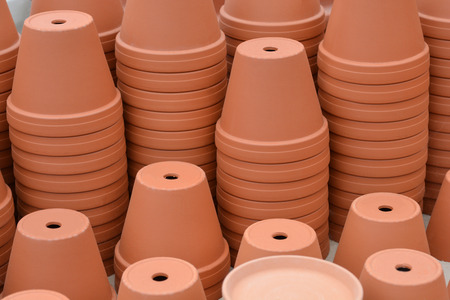 Lots of orange brown terracota flowerpotsの写真素材