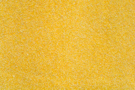 Detail of a surface covered in uncooked polentaの写真素材