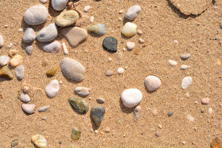 Detail of a sand beach with pebbles