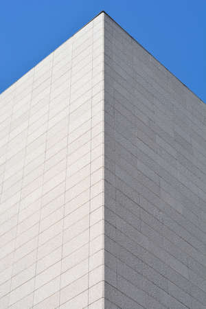 Corner detail of exterior building wall made of stoneの写真素材