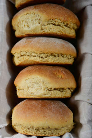 Close up of homemade baked honey oat beer buns