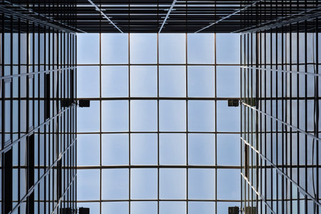 Detail of an glass and metal building and its reflection - like geometrical abstract backgroundの写真素材