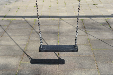 Close up of a playground swingの写真素材