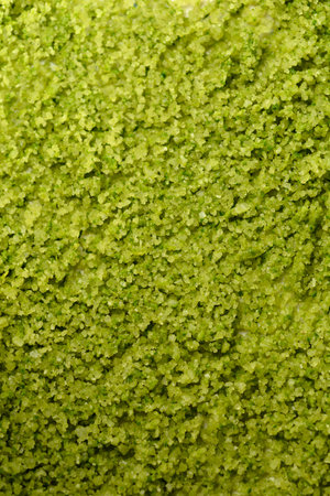 Top view of a surface covered with green basil-Infused sea salt