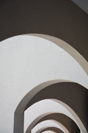 Abstract architectural composition - arches of a covered passage - play of light and shadow