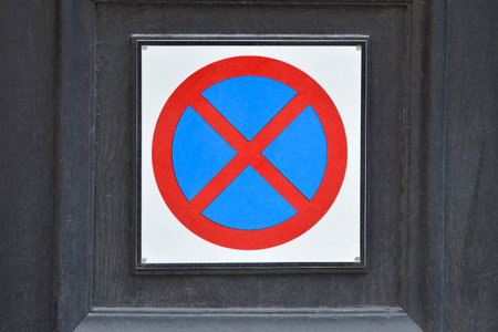 Detail of a door with a No parking signの写真素材