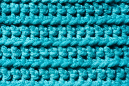 Close-up of extra thick crochet fabric in turquoise colors