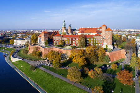 Krakow, Poland, with royal Wawel castle, cathedral and Vistula river in autumn. Aerial skyline panorama at sunset.の写真素材