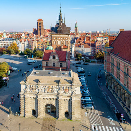 Gdansk, Poland. Old city with Renaissance Gate, called Brama Wyzynna ,  (Upland or High Gate) Prison Gate with torture chamber, St Mary church and  town hall tower.  Aerial view in sunset lightのeditorial素材