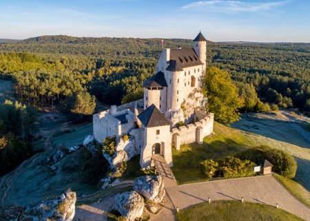 Medieval Castle in Bobolice, Poland, built in 14th century, renovated in 20th century. One of strongholds called Eagles Nests in Polish Jurassic Highland in Silesia. Aerial view in sunrise lightのeditorial素材