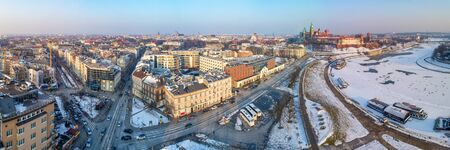 Krakow, Poland. Wide winter aerial panorama with old city, Wawel cathedral and castle, partly frozen...