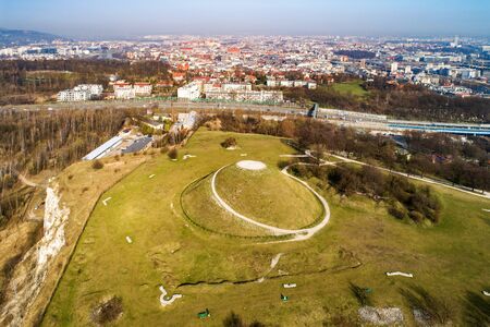 Krakus Mound -Kopiec Krakusa commemorating a legendary founder of the town. The origin of the mound, probably early medieval kurgan, is not known. City panorama in the backgroundの写真素材