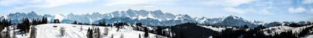 Extra wide panorama of Tatra mountains in winter viewed from Bukowina Tatrzanska in Poland. Good for a banner.の写真素材