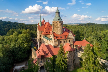 Czocha (Tzchocha) medieval castle in Lower Silesia in Poland. Built in 13th century (the main keep) with many later additions. Aerial view in summer in sunset lightのeditorial素材