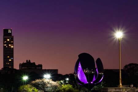 Metal flower in park on a beautiful purple sunsetの写真素材