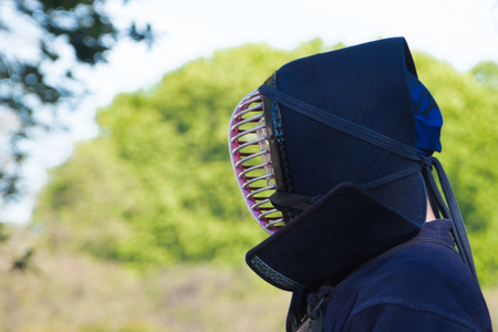 Samurai head against blured sunny backgroundの写真素材