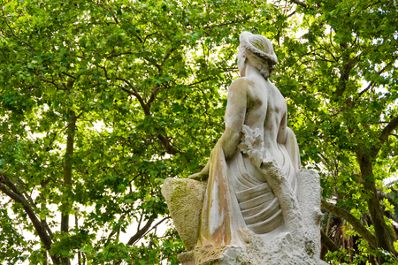 Woman statue in a park with green leaves background in La Plata Buenos Airesの写真素材