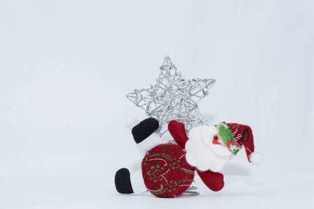 Adorable red Santa Claus with silver star and white background.の写真素材