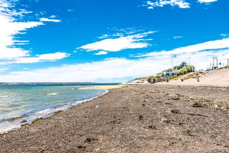 Puerto Madryn beach, sun, waves and sand, beautiful day.の写真素材